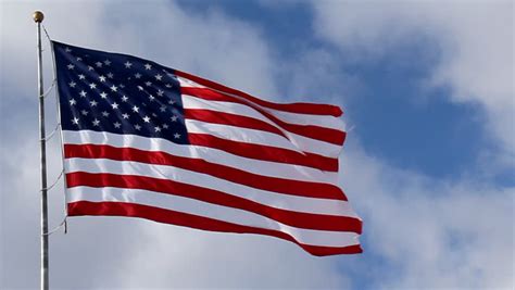 American Flag Waving Against Blue Sky Stock Footage Video 100 Royalty