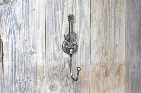 C $11.00 to c $11.76. Guitar Gold Coat Hook Cast Iron Music Room Hook | Etsy | Gold coating, Coat hooks, Gold