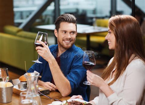 Couple Dining And Drinking Wine At Restaurant Stock Photo Image Of