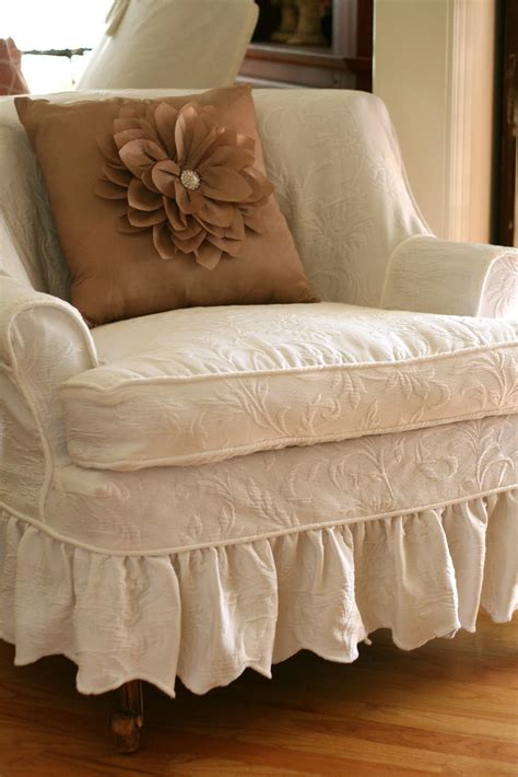 Antique sofa slip covered with a pink vintage chenille bedspread, pink pom pom trim and roses fabrics. Custom Slipcovers by Shelley: Matelesse Bedspread Slipcover