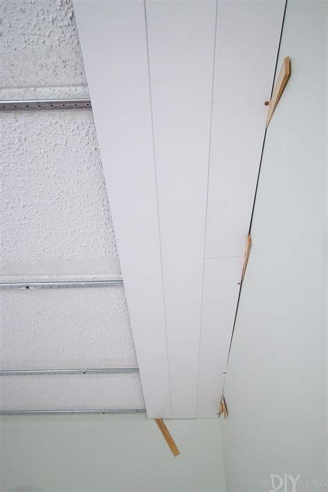 I'm not one to shy away from diy projects or getting dirty. How to Install Ceiling Planks to Cover Popcorn Ceilings ...