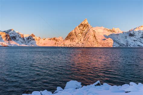 A Spectacular Snowy Mountain In The Arctic Fjord In Winter Picture And