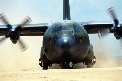 A C 130 Hercules Transport Aircraft Taxies On A Dirt Strip After Making