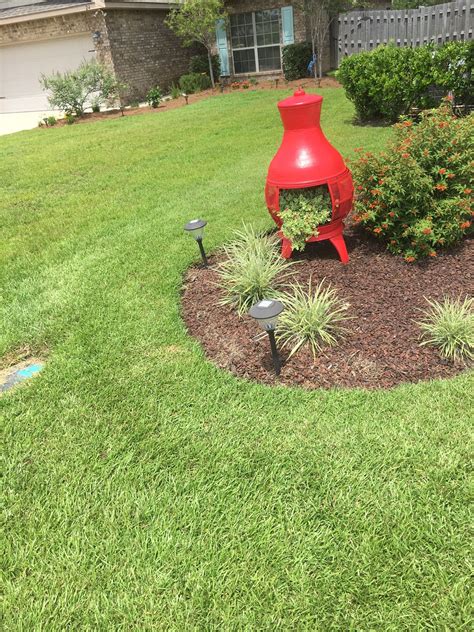 Florida beach weddin ideas / affordable all inclus. Chiminea painted then turned into a planter (With images) | Garden crafts, Garden decor, Garden art