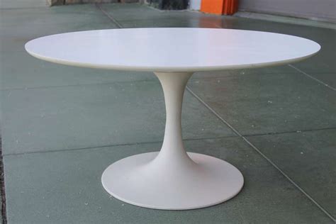 Burke décor also has plenty of options for the industrial or old world inspired designs, and choices can include coffee tables like furano with its antiqued mirror top set into a rectangular frame of tarnished brass. Small Tulip Table by Burke, manner of Saarinen at 1stdibs