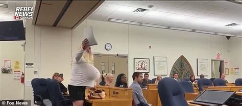 Protester Is Banned From Woke School Board Meeting After Dressing Up As Controversial Trans
