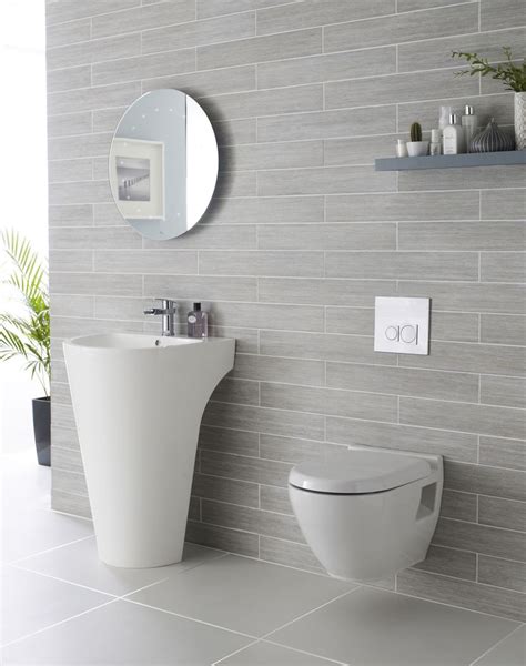 When you choose large tiles, you create a smaller number of long grout lines which draw the eye smoothly, making the room feel bigger. How Can I Make My Small Bathroom Look Bigger?