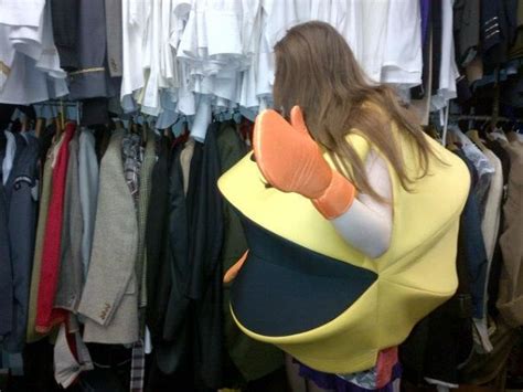 One Of My Daughters Dressed As A Smiley Face Browsing The Racks Of A
