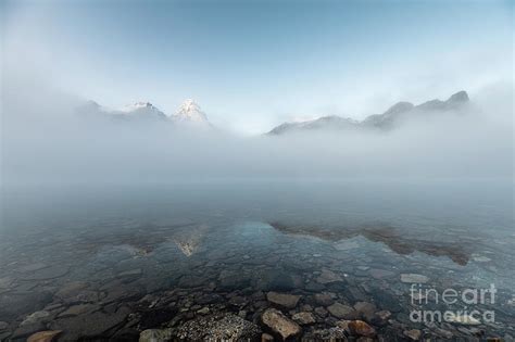 Mount Assiniboine In Blue Foggy Reflection On Lake Magog Photograph By