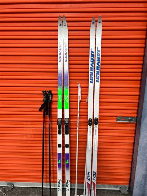 Lot Two Sets Of Jarvinen Cross Country Skis Two Sets Of Poles Two Ski Bags Adam S