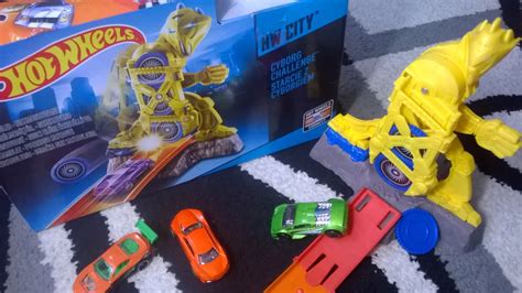 This incredible deluxe track set features a giant cyborg with swinging arm action that rips the highway in two. Hot Wheels Cyborg Challenge Track Set - YouTube