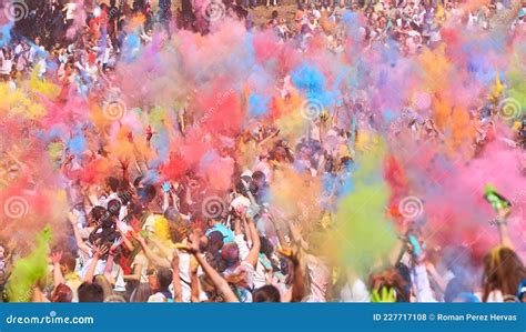 People At An Indian Holi Party Throwing Colored Powders Into The Air
