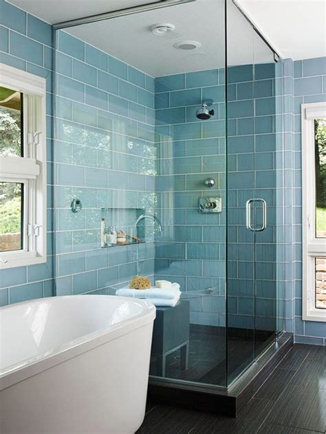 Modern bathroom with floor to ceiling ceramic tiles. Create a feeling of bathroom space: Floor to ceiling ...