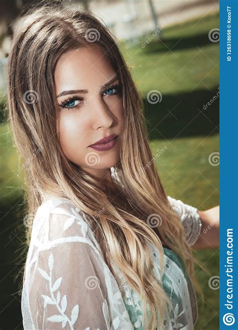 Portrait Of A Young And Beautiful Blonde Woman Blue Eyes