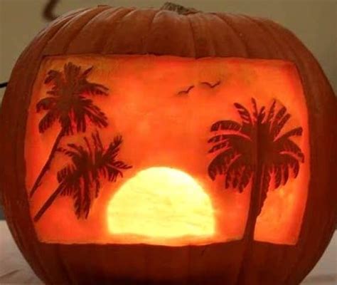 A Carved Pumpkin With Palm Trees On It