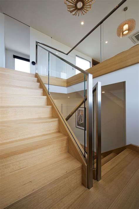The Stairs Are Made Of Wood And Glass