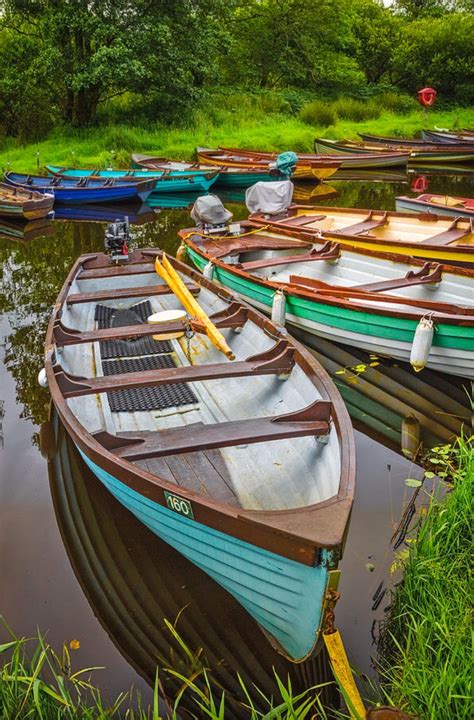 Rowboats In Summer Is A Photograph By Debra And Dave Vanderlaan A