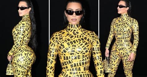 kim kardashian shows off her famous curves in just yellow tape as she attends the balenciaga