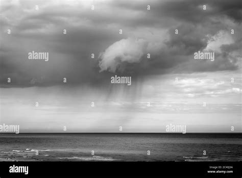 Rain Clouds Hanging Over The Sea Stock Photo Alamy