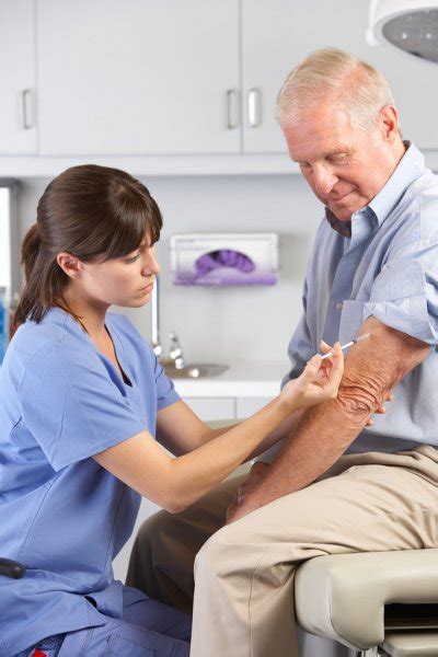 Doctor Examining Male Patient With Hip Pain Stock Photo By