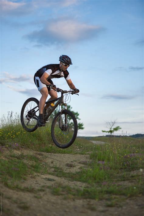 Man Riding And Jumping With His Mountain Bike Outdoor By Stocksy Contributor Ibex Media