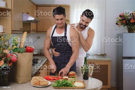 Caucasian Lgbtq Gay Couple Enjoying Cooking Food Together In Kitchen Concept Of Lgbtq Same Sex