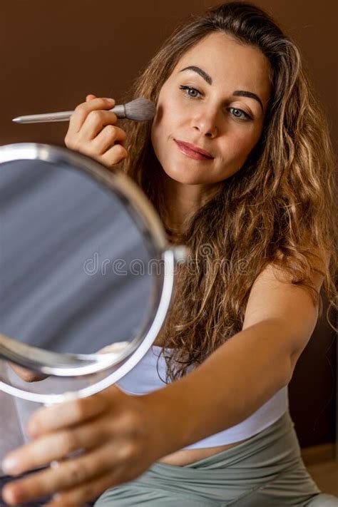 Beautiful Female Applying Face Tone Powder Foundation Blush Use Brush Looking At Mirror Makeup