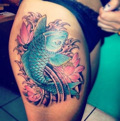 Koi fish and lotus flower tattoos incorporating a lotus with a koi fish in your tattoo will show how beauty can even come from an unpleasant place as is the case with the growth of a lotus flower. Koi Fish Thigh Tattoo Designs, Ideas and Meaning | Tattoos ...