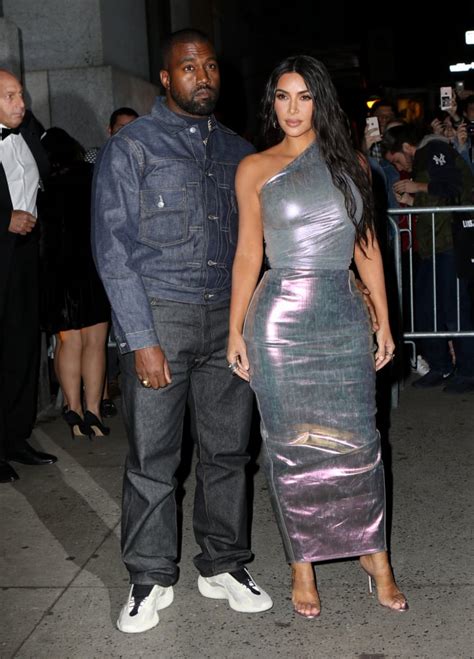 kim kardashian wearing an iridescent dress with kanye west at fgi s 2019 night of stars kim