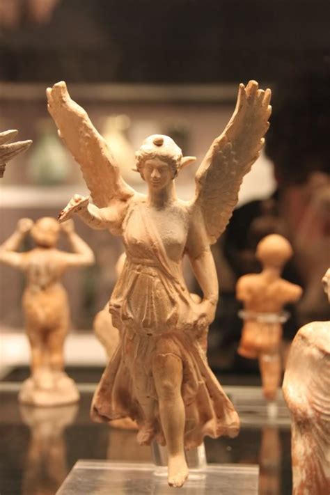 two terracotta statues of winged nike victory these are of course small statues but the