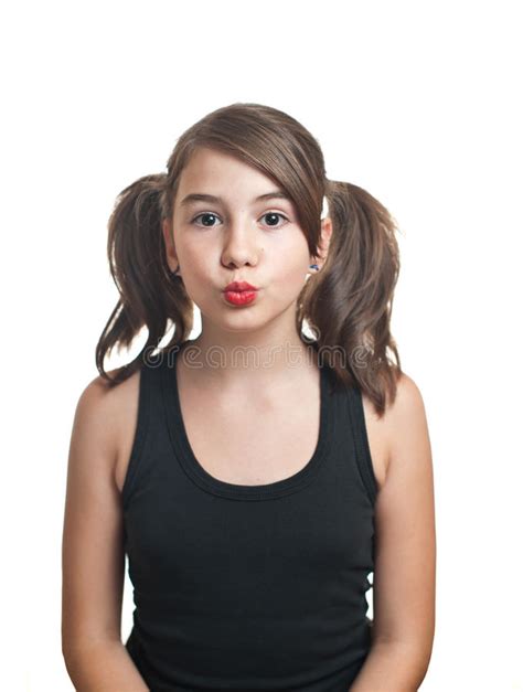 A Beautiful Teen Girl In Black Top With Pigtails Stock