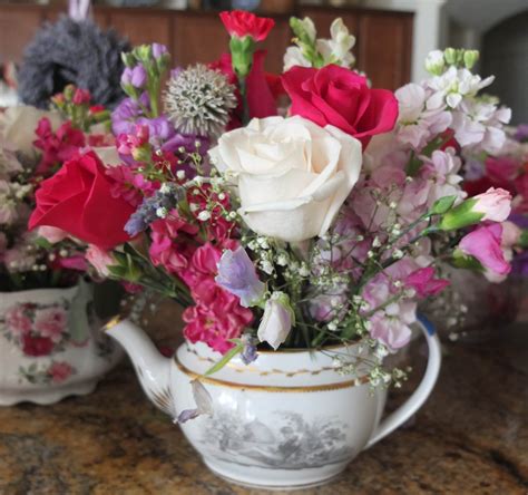 Antique Style Antique Teapot Flower Arrangements At A Wedding