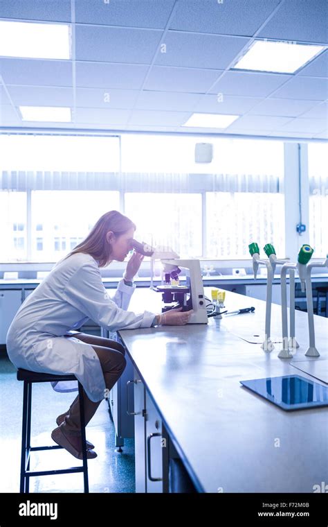 Scientist Working With A Microscope In Laboratory Stock Photo Alamy