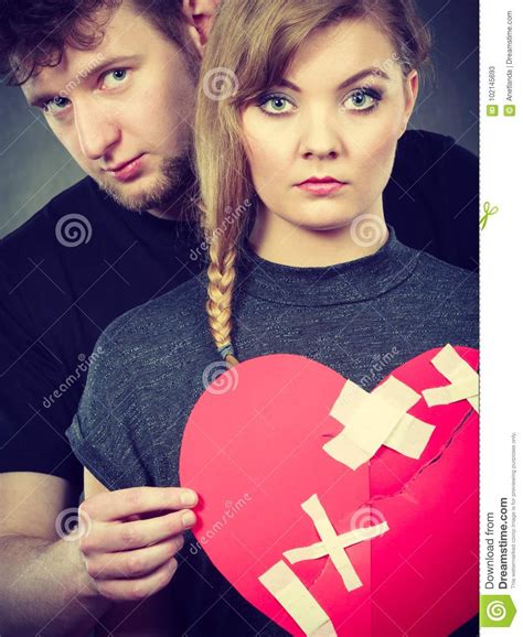 Sad Couple Holds Broken Heart Stock Image Image Of Disappointed