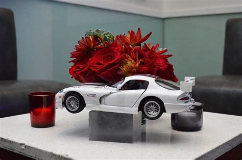 Flower And Car Centerpiece Courtesy Of Black Dahlia Designs Car