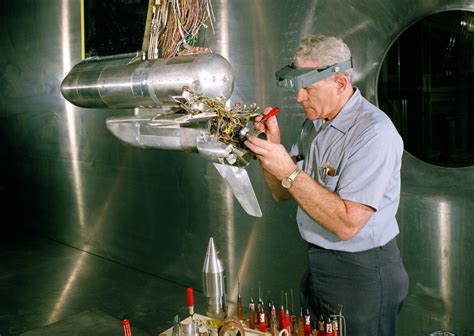 Nasa Engineer Working On A Model Of The Space Shuttle Before Testing In