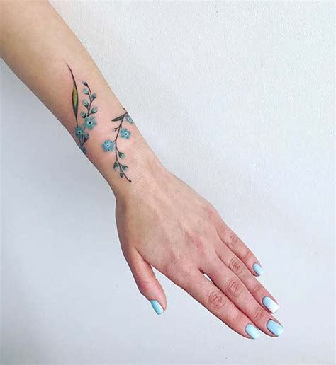 Cute Feminine Flower Armband Tattoo On Wrist Tattoo