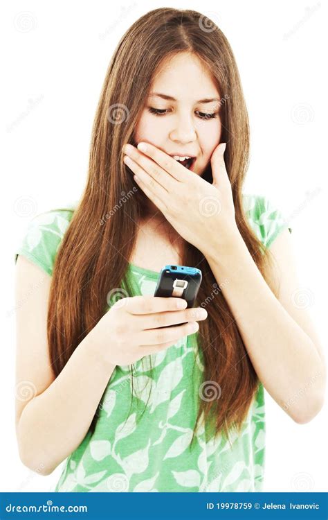 surprised teen girl looking at the mobile phone stock image image of brunette cute 19978759