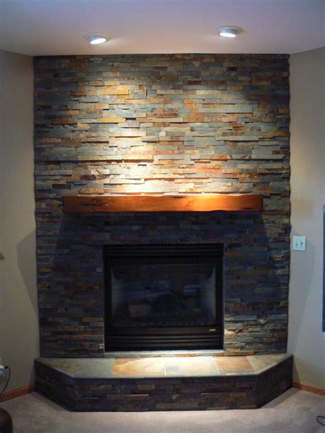 Fireplace surrounds in marble, wood and tile designs for modern, rustic and period homes. Stacked Stone Corner Fireplace … | Fireplace ideas | Pinterest | Corner, Stone and Basements