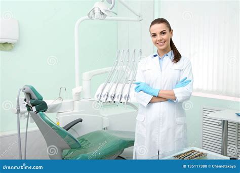 Young Female Dentist In White Coat At Workplace Stock Photo Image Of