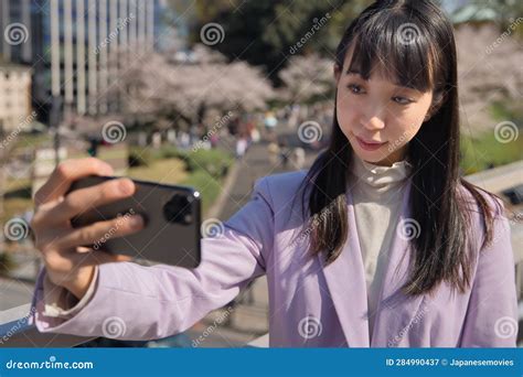 A Portrait Of Selfie By Japanese Woman Behind Cherry Blossom Bust Shot Stock Image Image Of