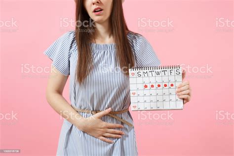 Portrait Sad Sickness Woman In Blue Dress Holding Periods Calendar For