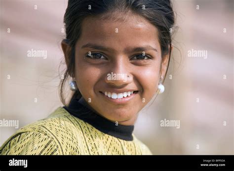 A Young Girl At The Ganges Riverside In The Hindu Holy City Of Varanasi