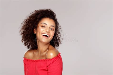 Happy Smiling African Woman With Afro Hairstyle Looking At Camera Stock