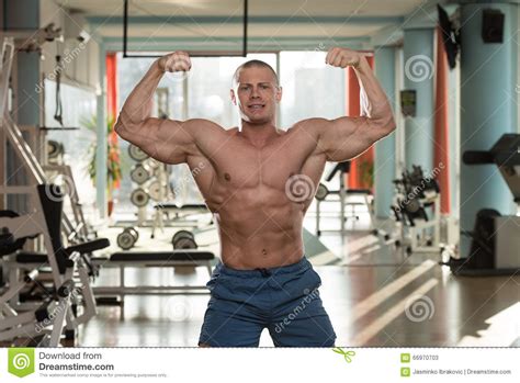 Young Bodybuilder Flexing Muscles Stock Image Image Of Healthy