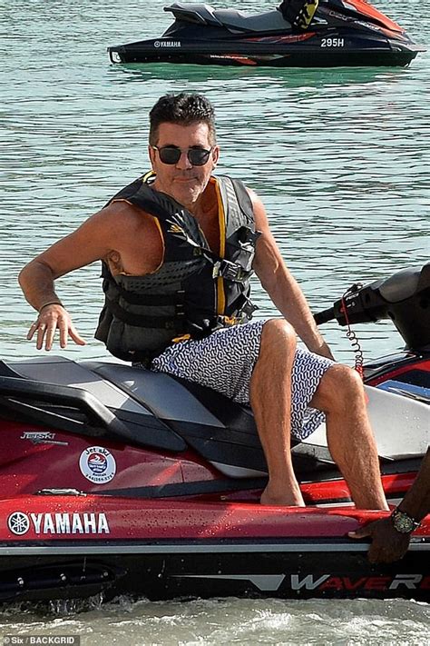 Simon Cowell Continues To Show Off His New Buff Body In Low Slung Shorts Daily Mail Online
