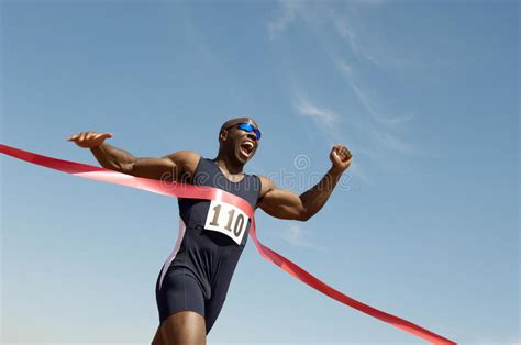 Male Runner Winning Race stock photo. Image of racing - 30843844