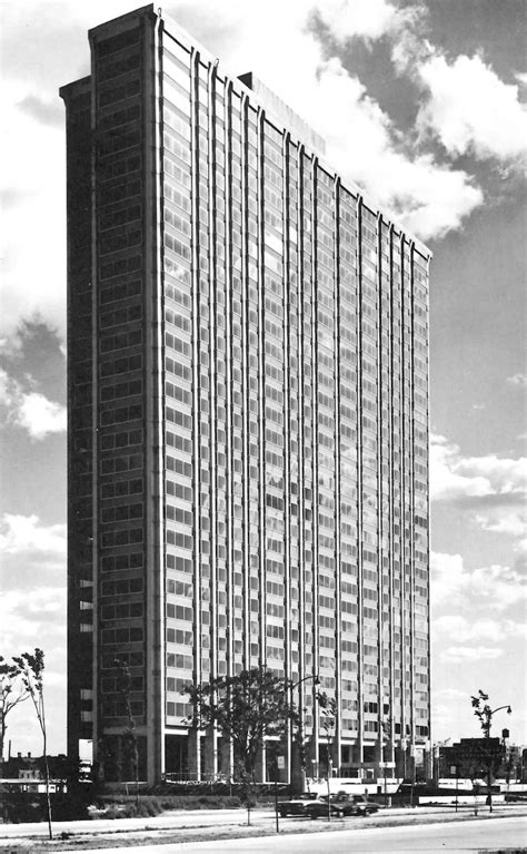 An Old Black And White Photo Of A Tall Building