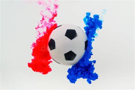 Soccer Ball With Red And Blue Color Splash On White Background Stock