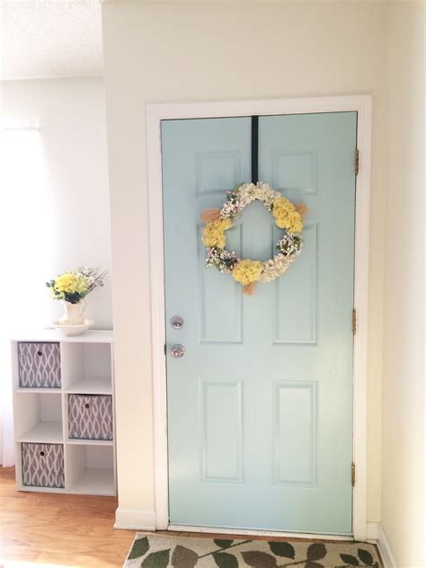 Maybe you would like to learn more about one of these? Sherwin Williams- Watery Blue door with yellow wreath ...